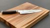 
                    Tim Mälzer utility knife on cutting board Schneidholz