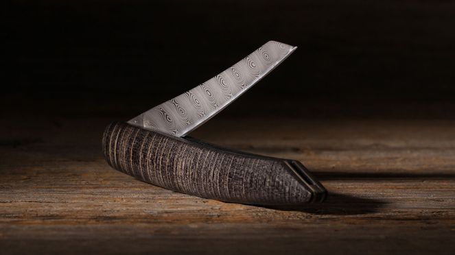 
                    Pocketknife damascus swiss knife folded made by the sknife manufactory in Biel